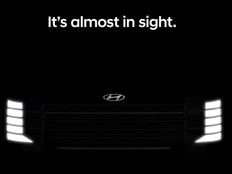 Hyundai Indonesia new car teaser showing front silhouette of next-gen Palisade with vertical grille and stacked headlights - autoini